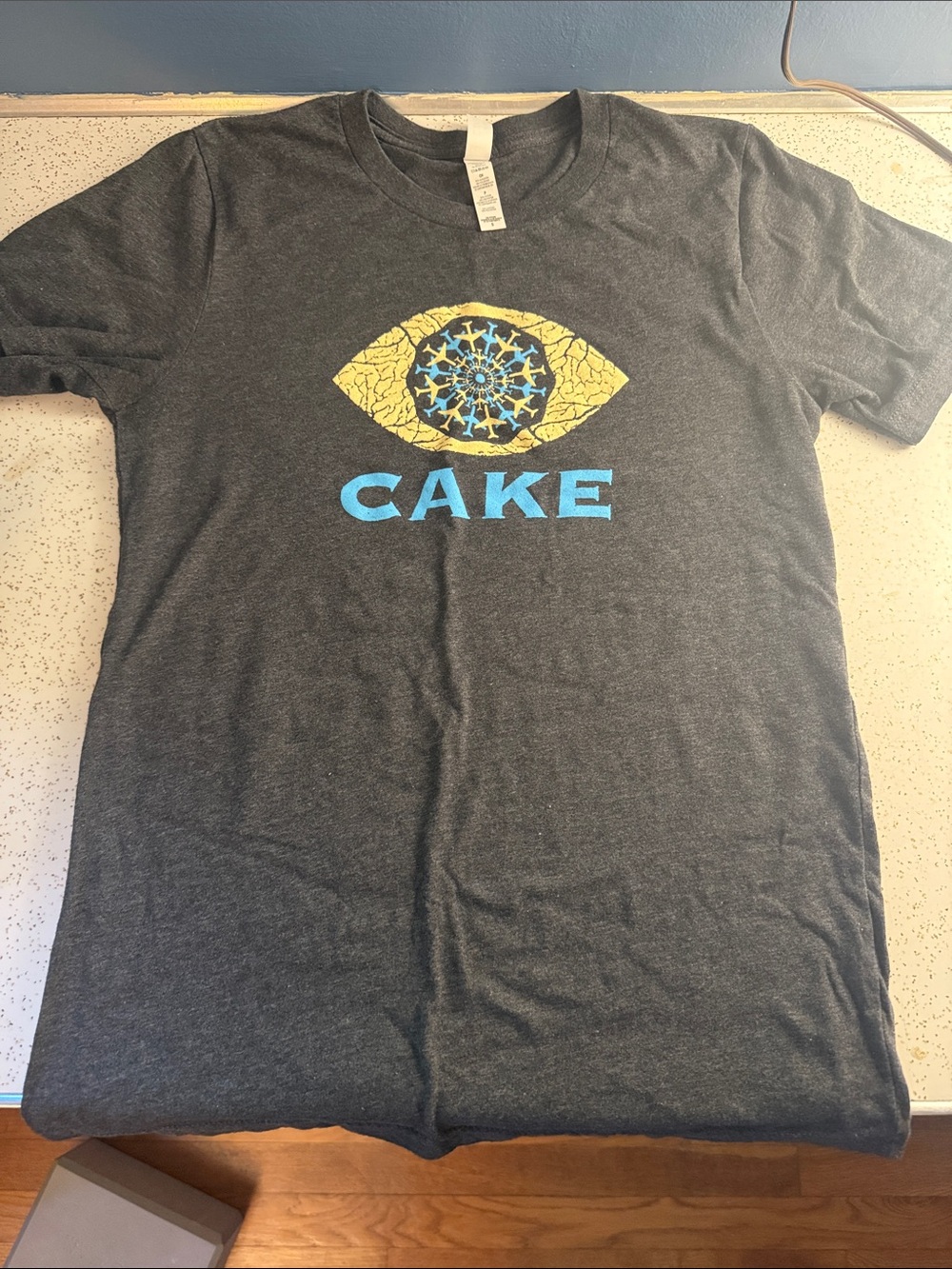 Bella Canvas Charcoal Tee with Yellow & Blue Eye Graphic